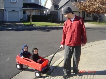 My grandtwins taking a ride in their hood