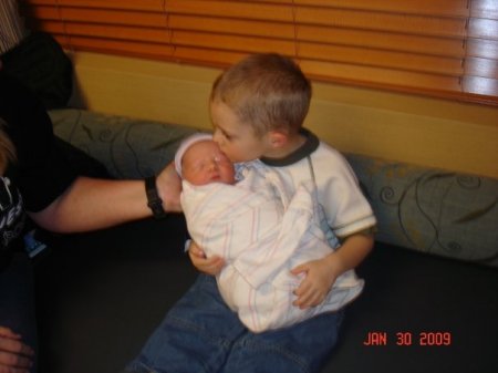 our grandson James with his new little brother