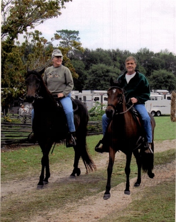 My husband Jack and me riding our horses