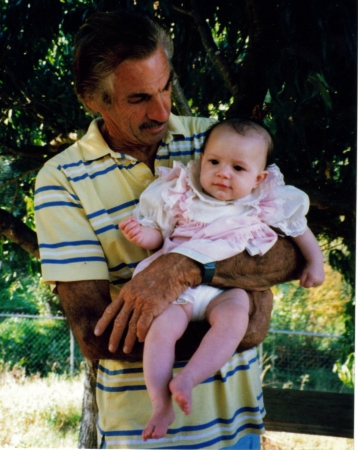 dad holding Tiana one year old