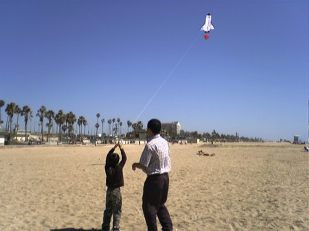 flying kite at huntington beach