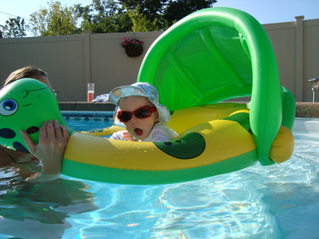 Our lil angel out in the backyard pool