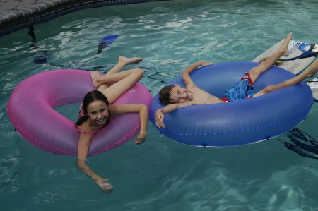Grandkids, Marli & Leyton swimming in our pool