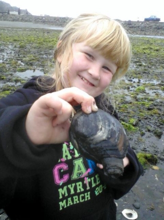 Zoe showing off what we dug up while clamming