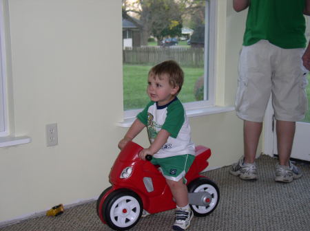 Ean - on his toy motorcycle