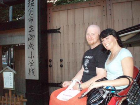 the newleyweds on a rickshaw ride in japan