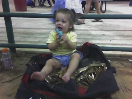 Peyton sitting on Pawpaws riggin bag 2008