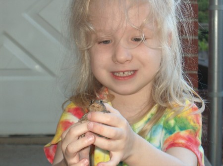 Ani catches a toad