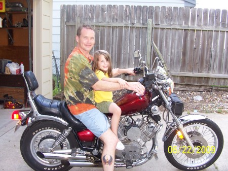 My bf and my daughter Maddie on his bike