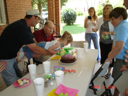 Madison blowing out Daddy's Birthday candles