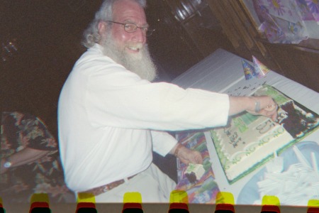 Tommy Leahy cuts the cake.................