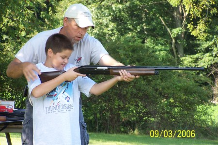 My youngest son Collin and Dad shooting