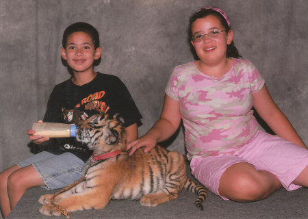 Kids with tiger cub