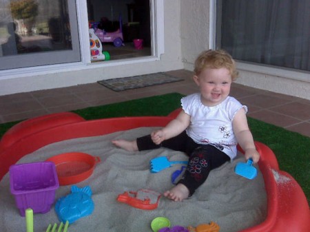 Abby in her sandbox