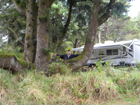 Neat tree at campsite with hubby showing size.