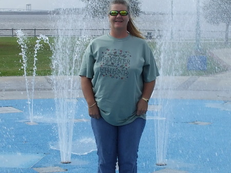 me standing in a water fountine