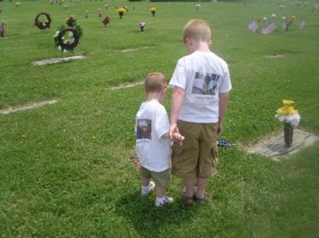carson and caden at thier grandpas grave