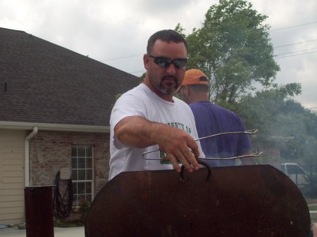 my son grilling at pool party june 09