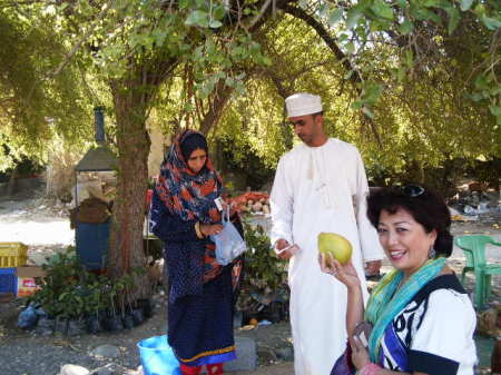 Ivy with roadside fruit vendors in Oman.11.07