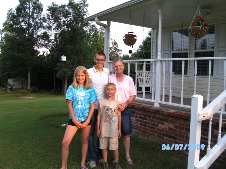 My three grandchildren with me