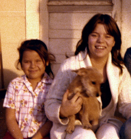 Linda Guzman (holding dog) and sister Missy