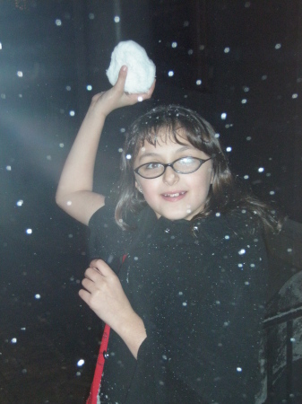 Sophia throwing a snow ball at me.