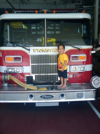 my grandson at my friends station house