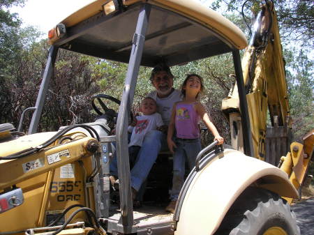 Haley and Johnathan on the backhoe