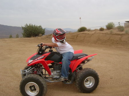 Elijah riding the Quad