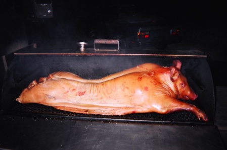 smoke roasting a pig