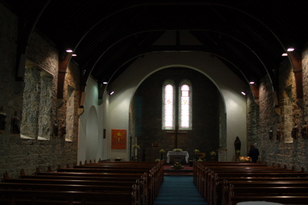 Lighting a candle in church, Inismore