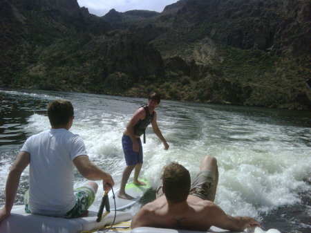 Son Josh "SURFING" off the back of our boat