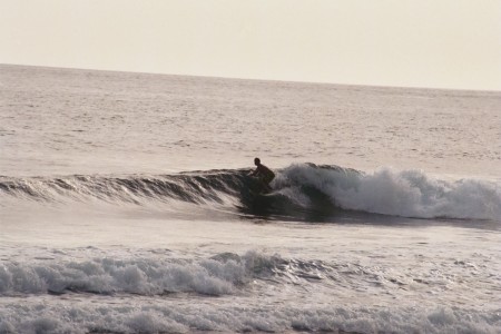 Mike surfing in Lombok; photo by Charlie