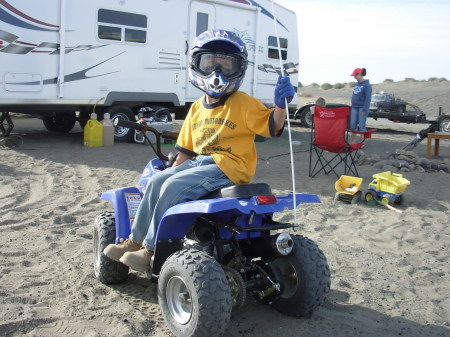 Grandson Hunter boy on his quad