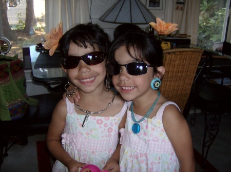 my twin granddaughters playing dress up