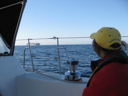 Kathie watchng a north bound container ship