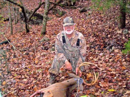 My husband, Russell & his 8pt. buck.