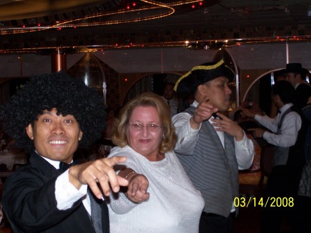 Me on a cruise doing a line dance with waiters