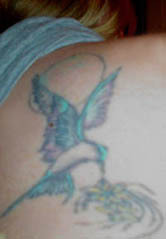 Hummingbird tat on my back