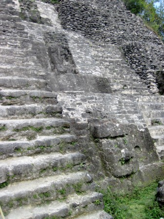 Figures to the right of stairs.