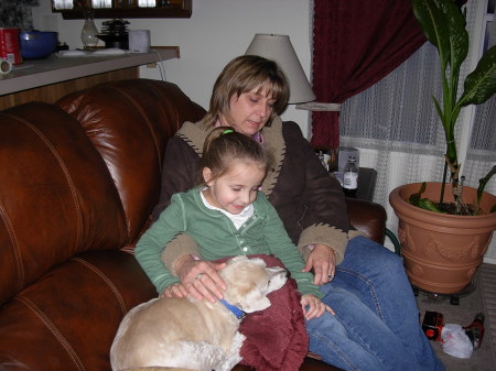 Our daughter-in-law, granddaughter and dog.