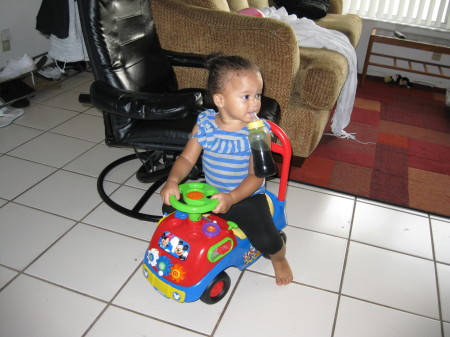 Christa taking driving lessons in living room