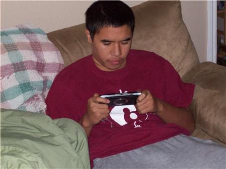 My son playing his PSP