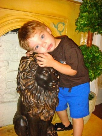 Caiden hugging the lion