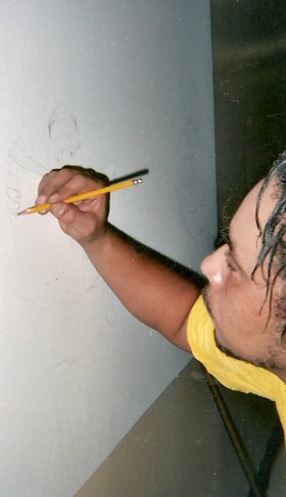 Me painting a mural at merritt athletic