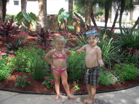 GIANNA AND AUSTIN IN THE GARDEN BEHIND THE POO