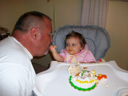 Caroline's 1st cake, sharing with Papa