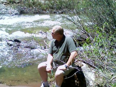 rod sitting by creek in co