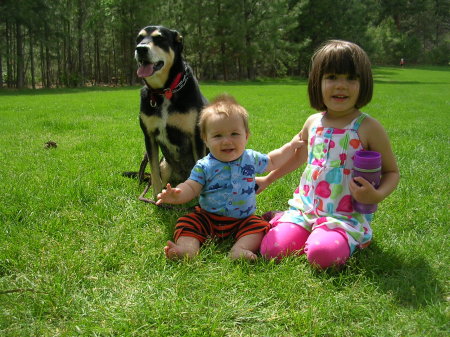 one of our grand dogs and 2 grand kids