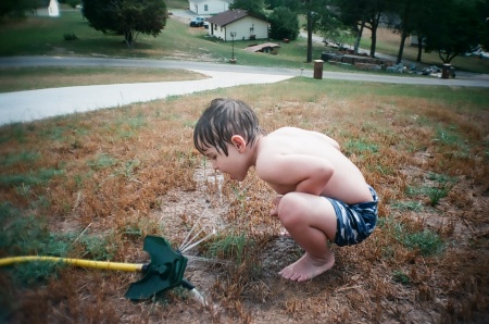 Grandson Gavin meets the sprinkler!